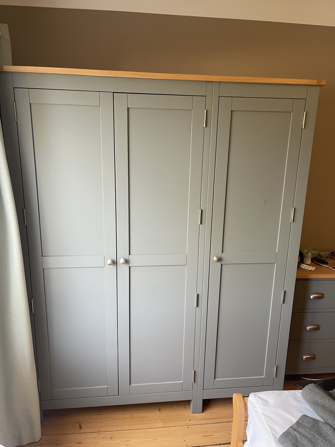 Grey triple wardrobe with three doors