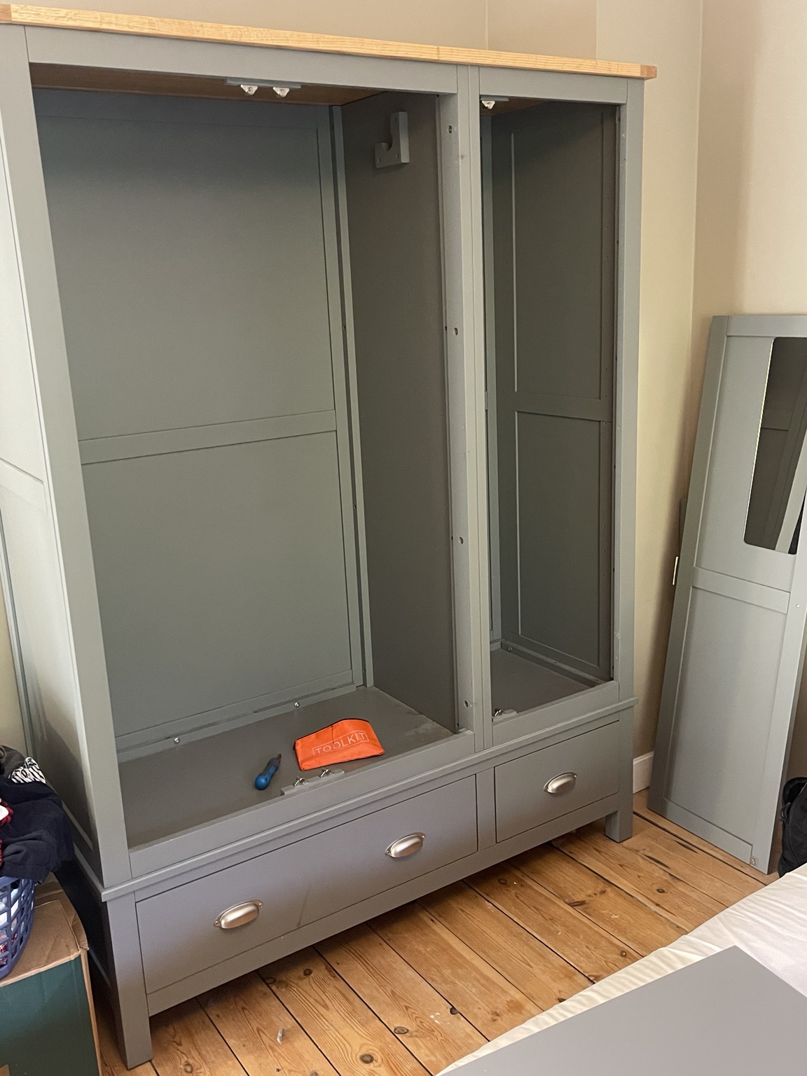 Grey wardrobe with doors removed